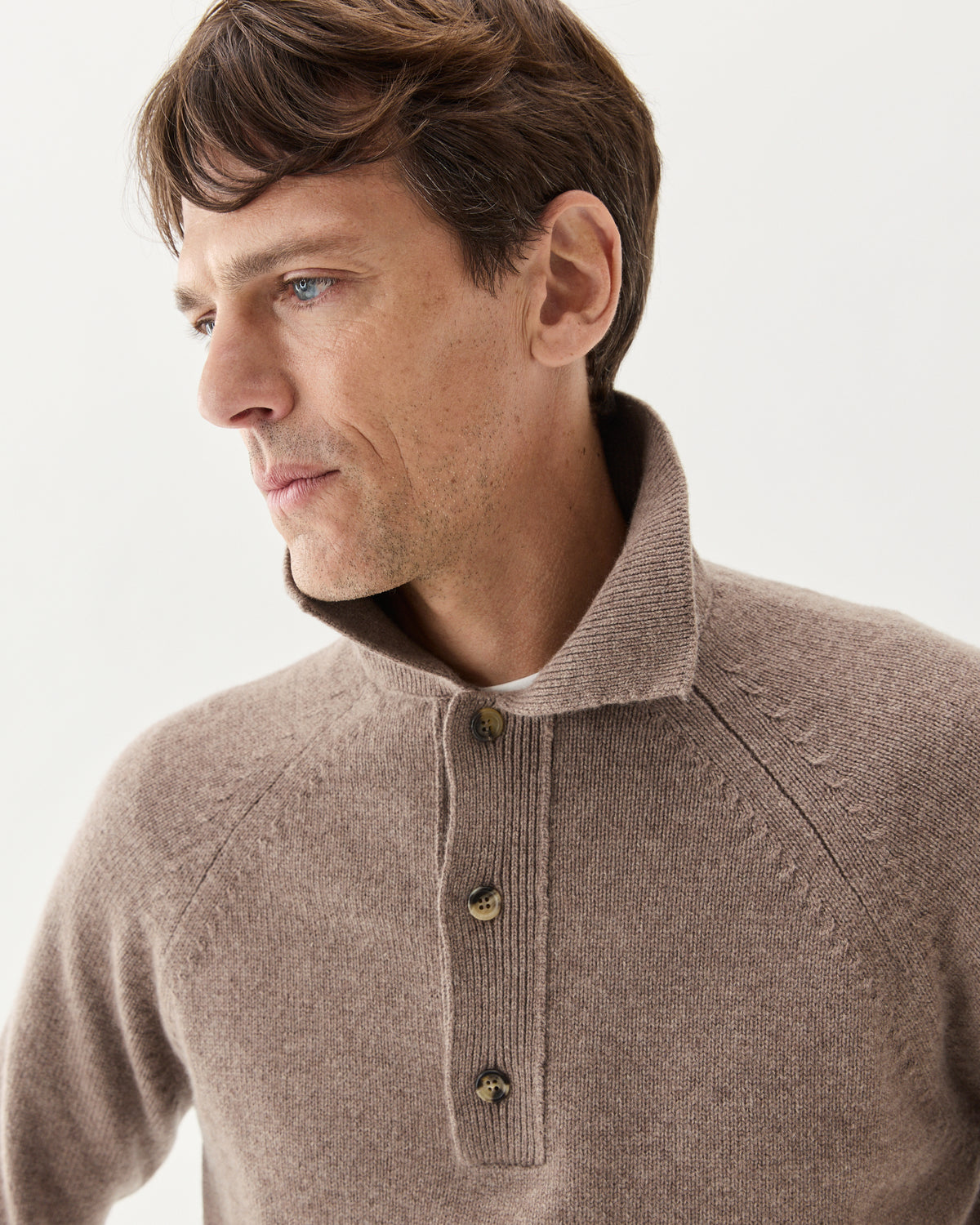 Chunky Cashmere Polo Taupe, worn over a white T-shirt, close-up