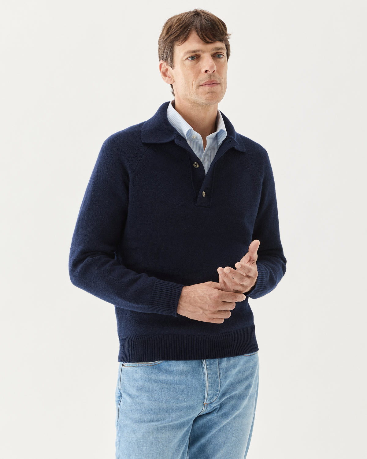 Chunky Cashmere Polo Navy, worn over a light blue shirt with jeans