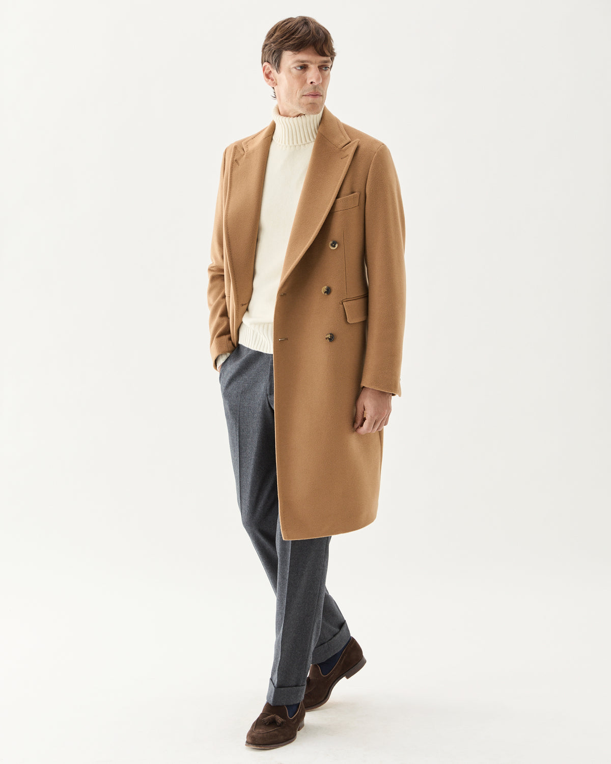 Double Breasted Cashmere Coat Camel, worn over a white turtleneck with grey trousers