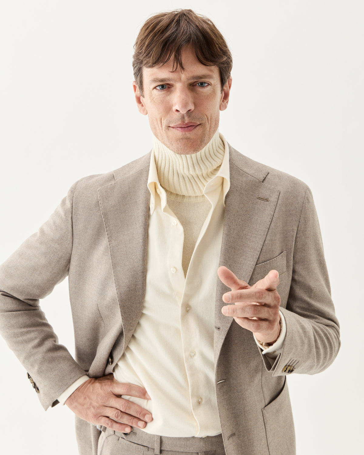 Wool Cashmere Blazer Taupe, worn over a cream turtleneck with the matching trousers, close-up