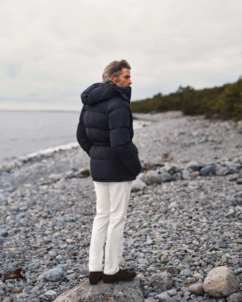 Navy down parka worn with warming off-white moleskin trousers